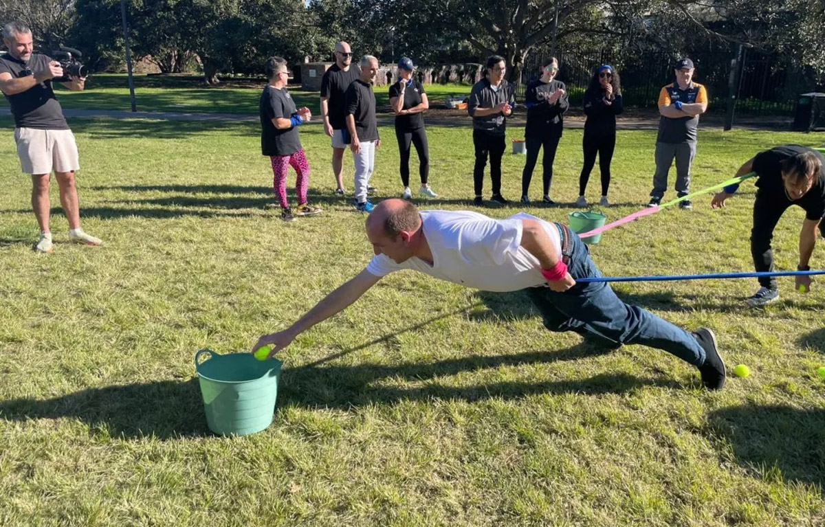 Team completing a challenge during Corporate Amazing Race team building activity
