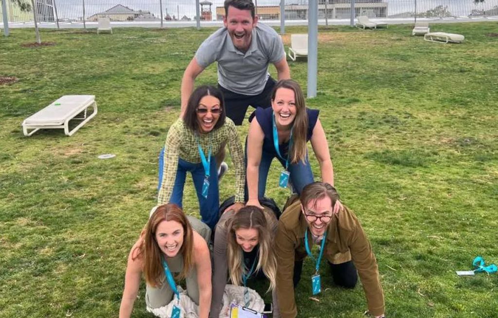 Corporate group enjoying outdoor team building activities together