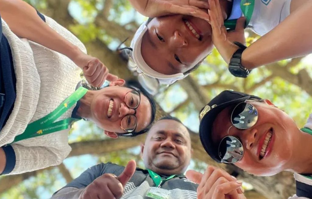 Team completing a challenge during Corporate Amazing Race team building activity