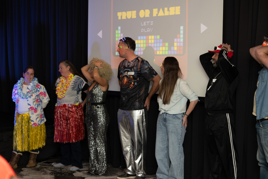 Corporate quiz night team building activity with staff competing in trivia