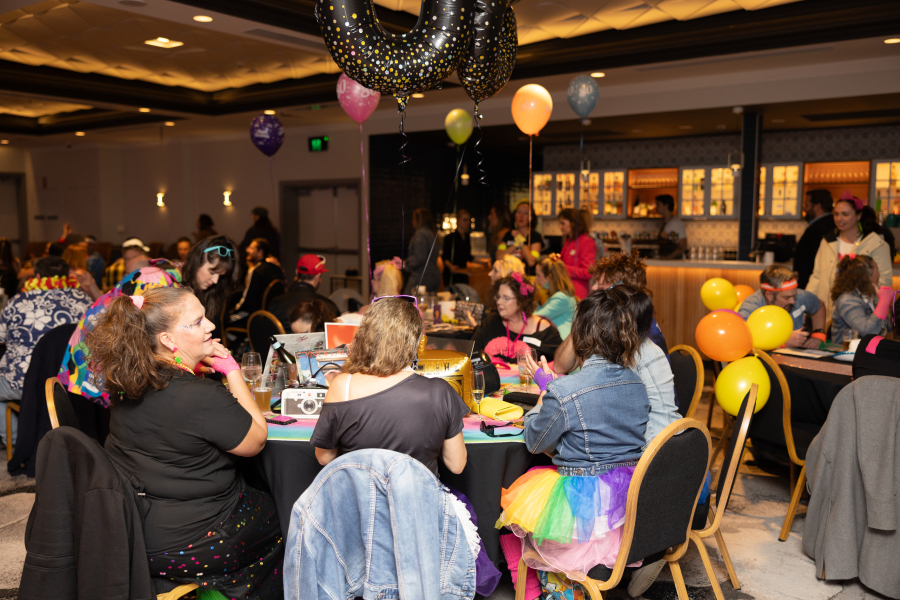 Corporate quiz night team building activity with staff competing in trivia