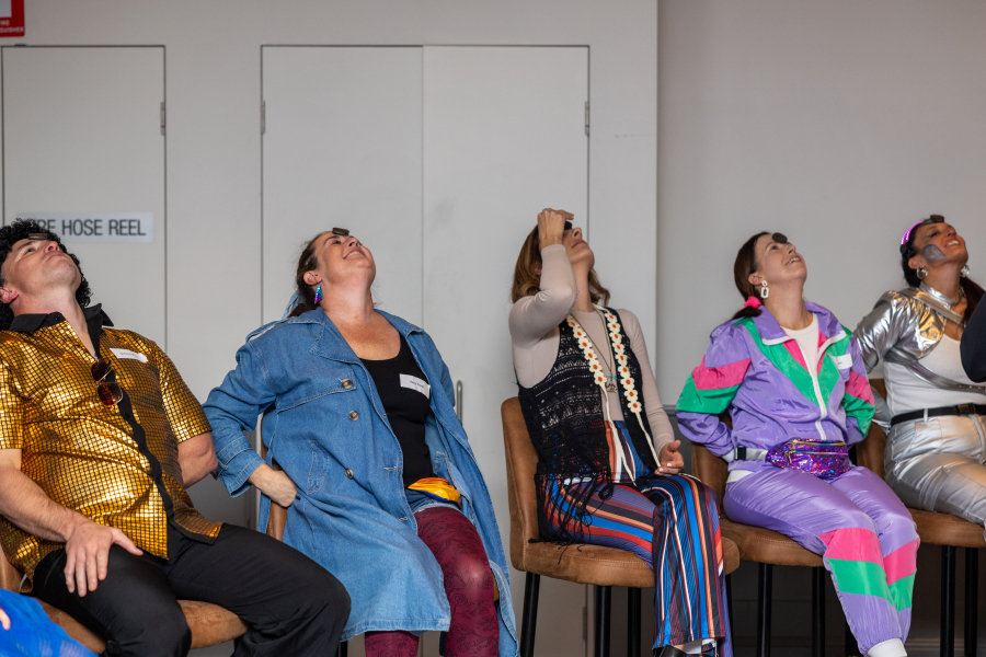 Corporate quiz night team building activity with staff competing in trivia