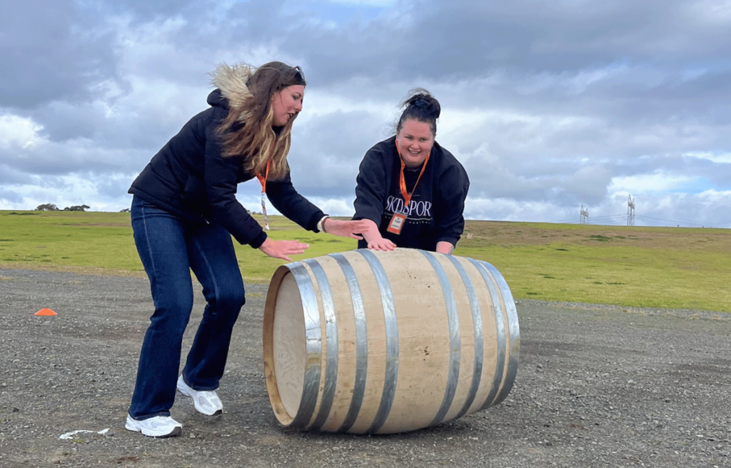 Team completing a challenge during Corporate Amazing Race team building activity