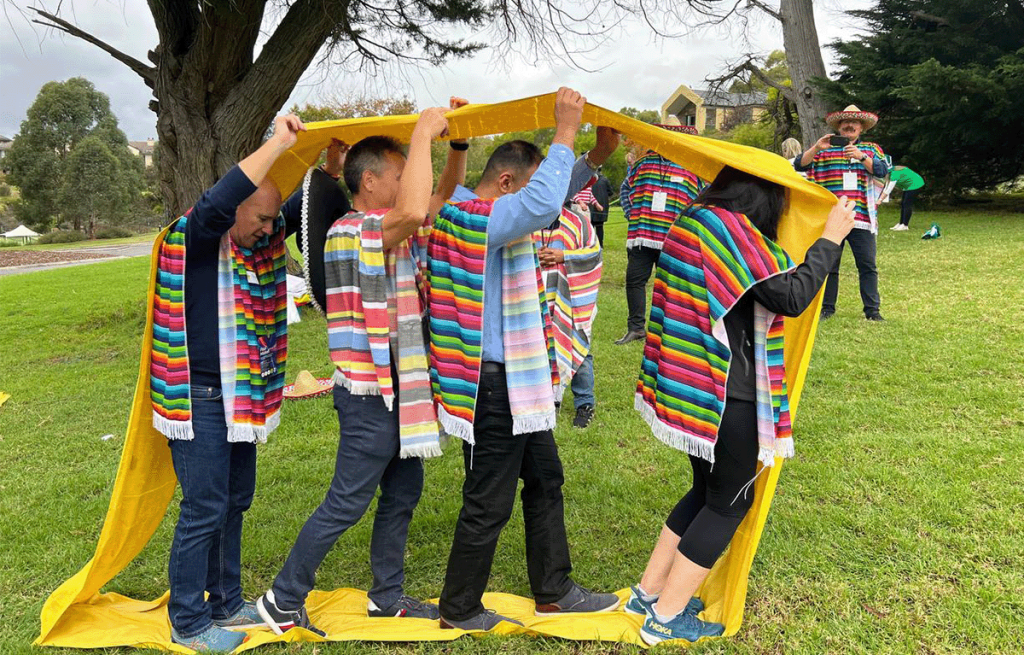 Team completing outdoor challenges during corporate team building in Sydney