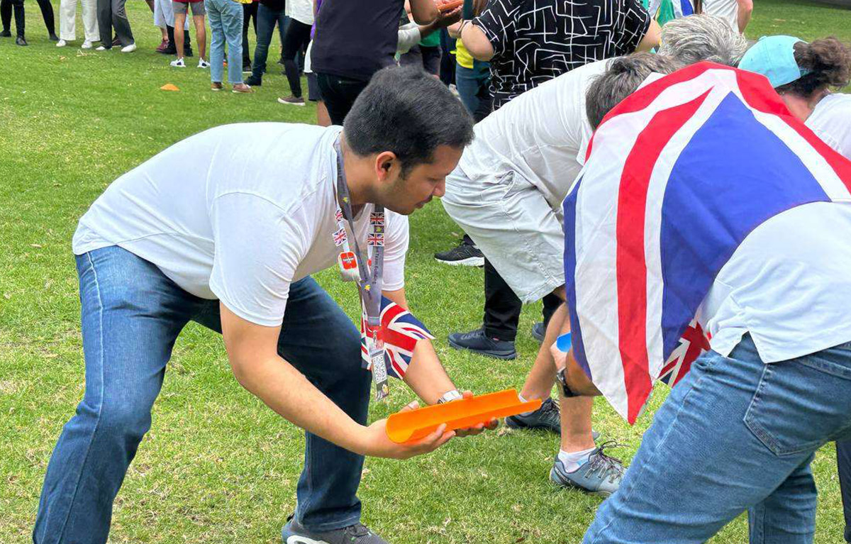 Teams competing in olympic style challenges for a team bonding day