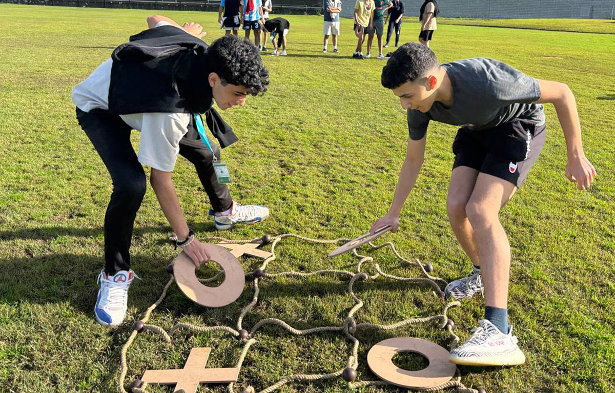 Teams competing in olympic style challenges for a team bonding day