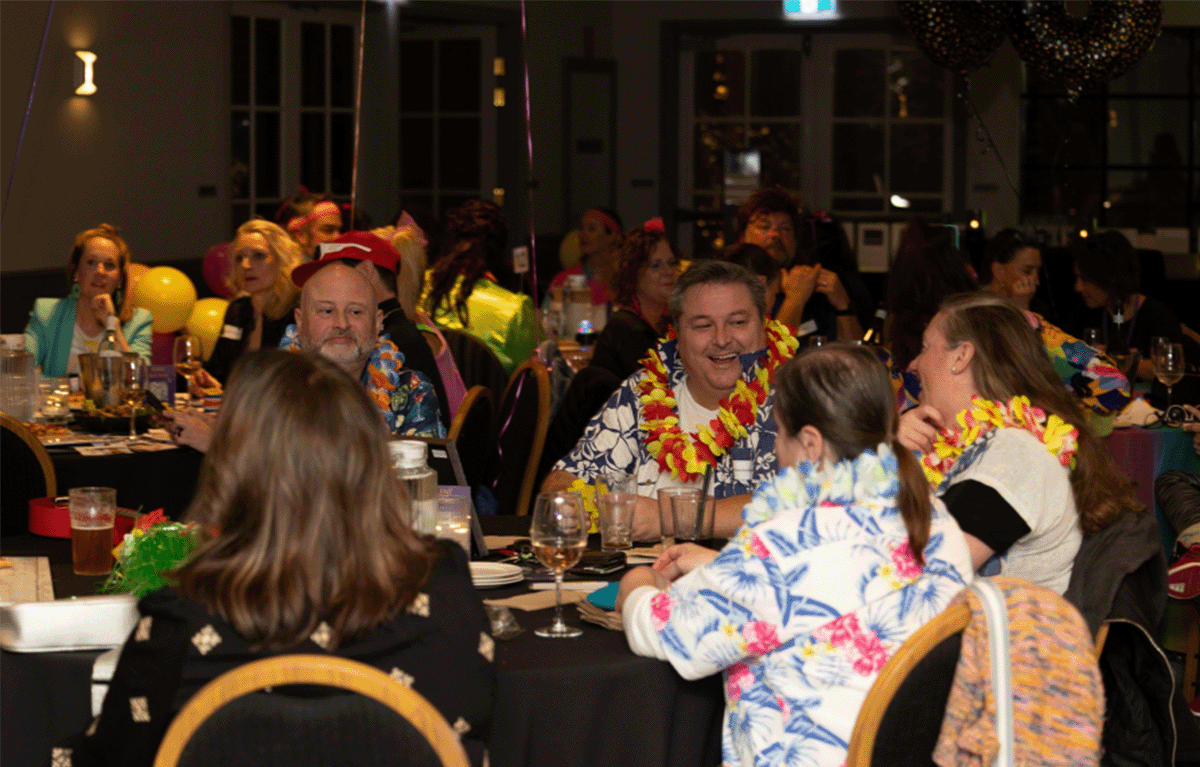 Corporate team building event with quiz master hosting trivia rounds