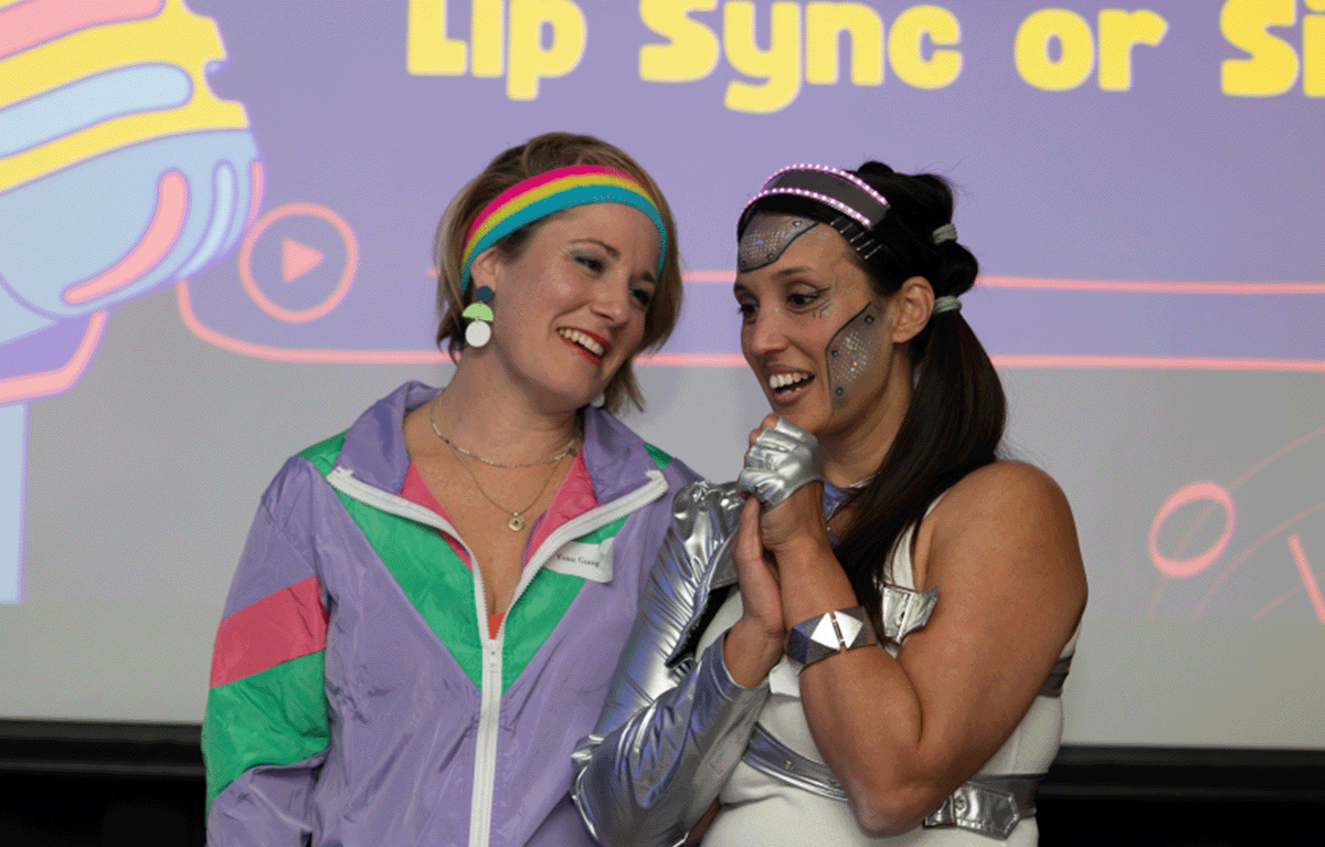 Corporate team building event with quiz master hosting trivia rounds