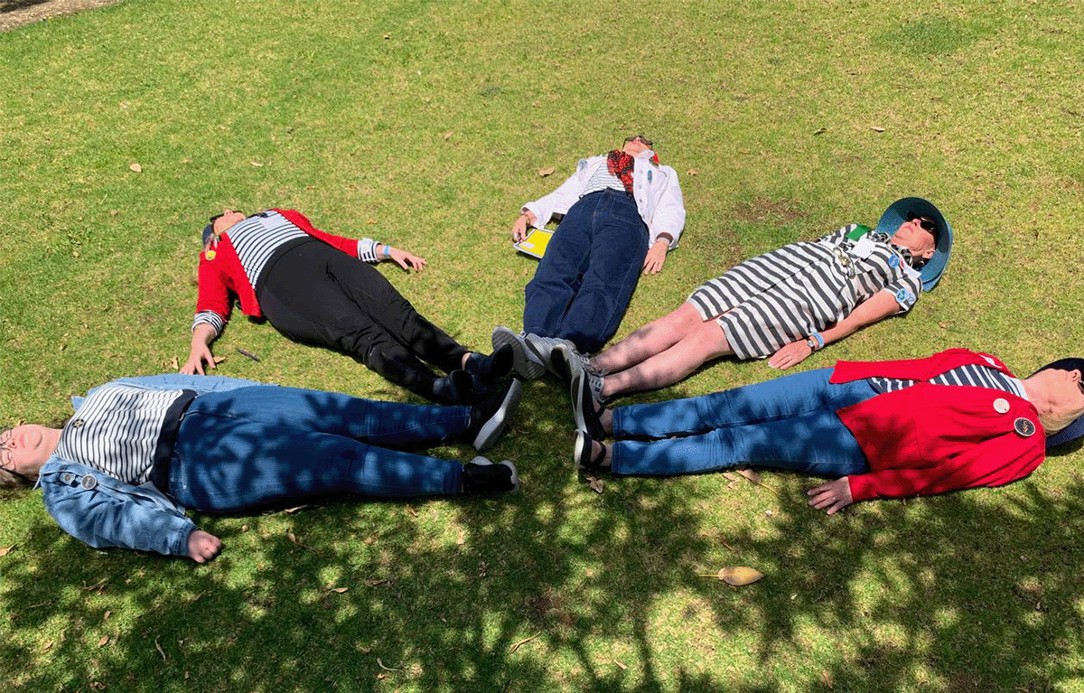 Teams competing in a hilarious team challenge during the Corporate Amazing Race Perth