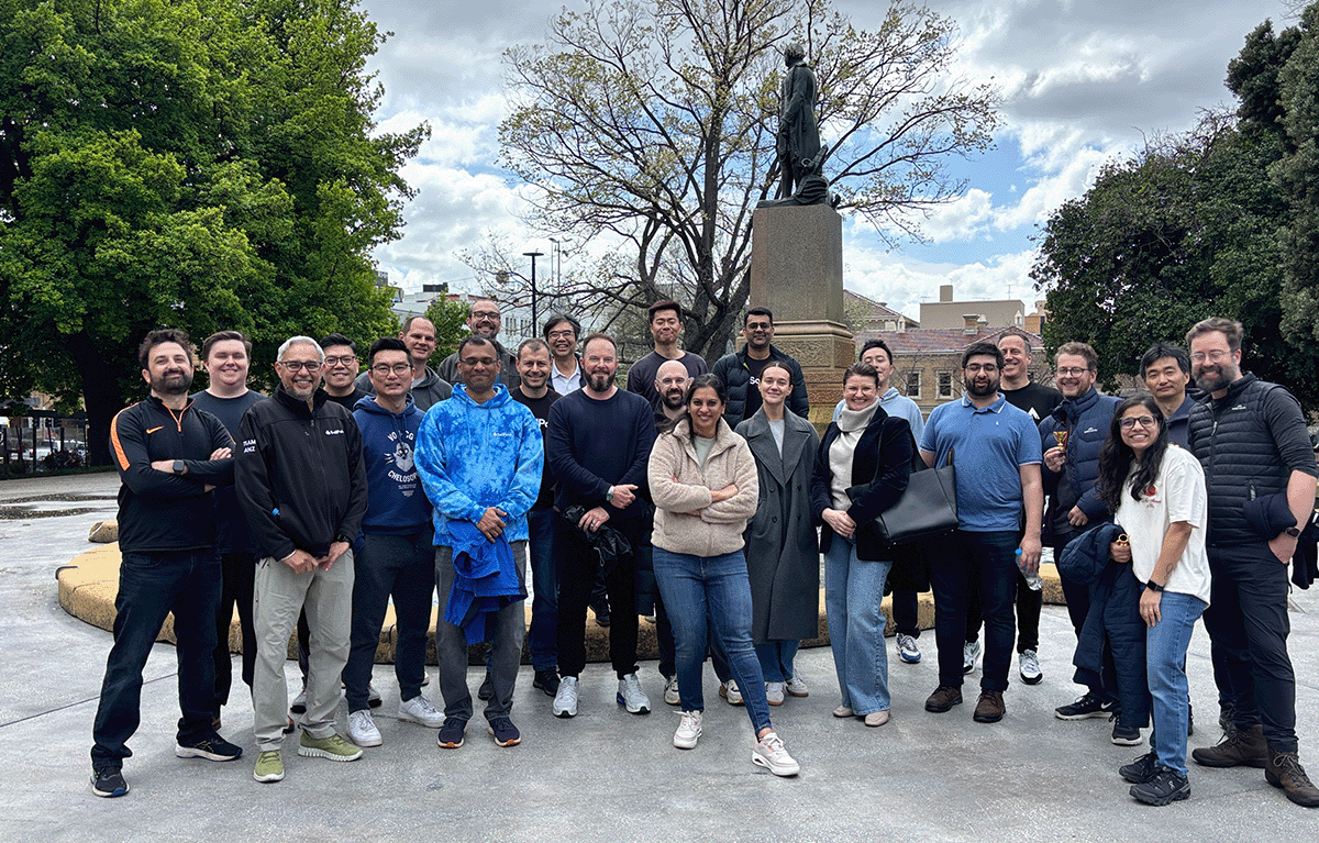 Fun group activities Hobart – colleagues laughing during a creative outdoor team building challenge