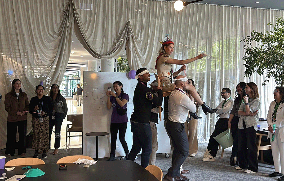 Teams enjoying a fun indoor team building day in Melbourne