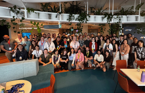 Indoor team building event with high-energy product presentations