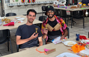 Teams brainstorming ideas during an indoor innovation team building challenge