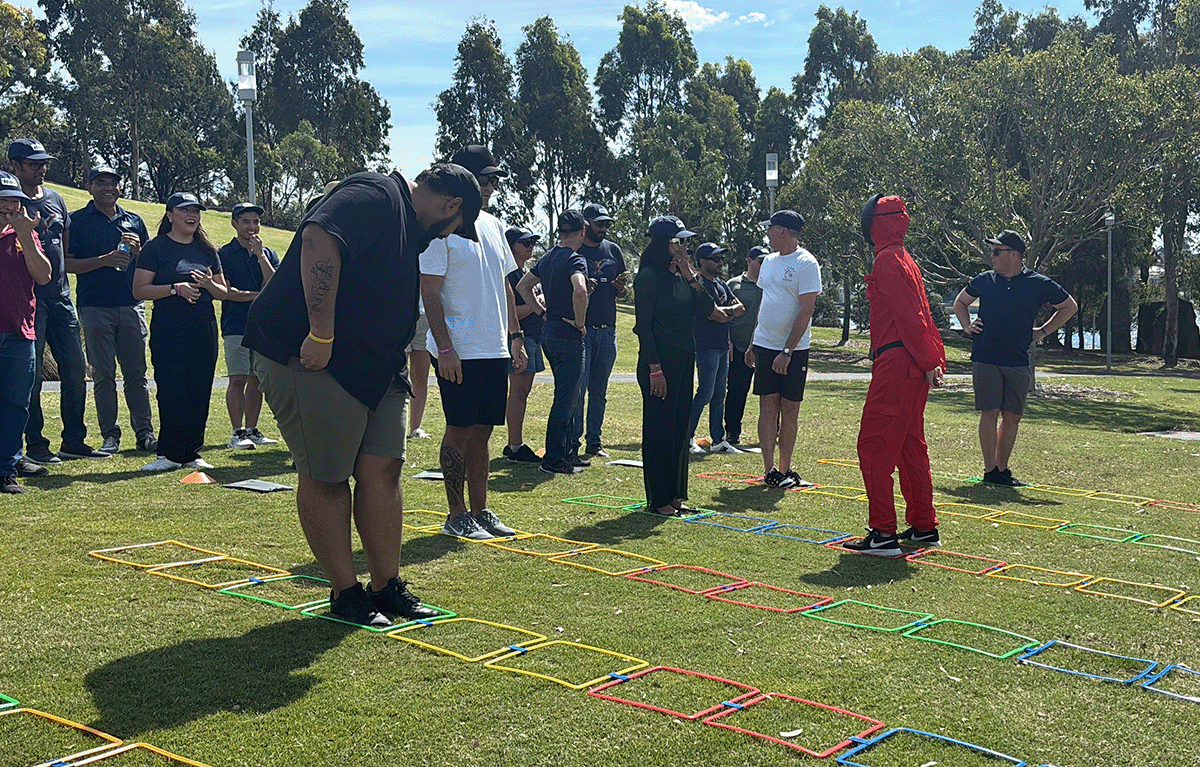 Teams having fun during an outdoor squid games team building activity
