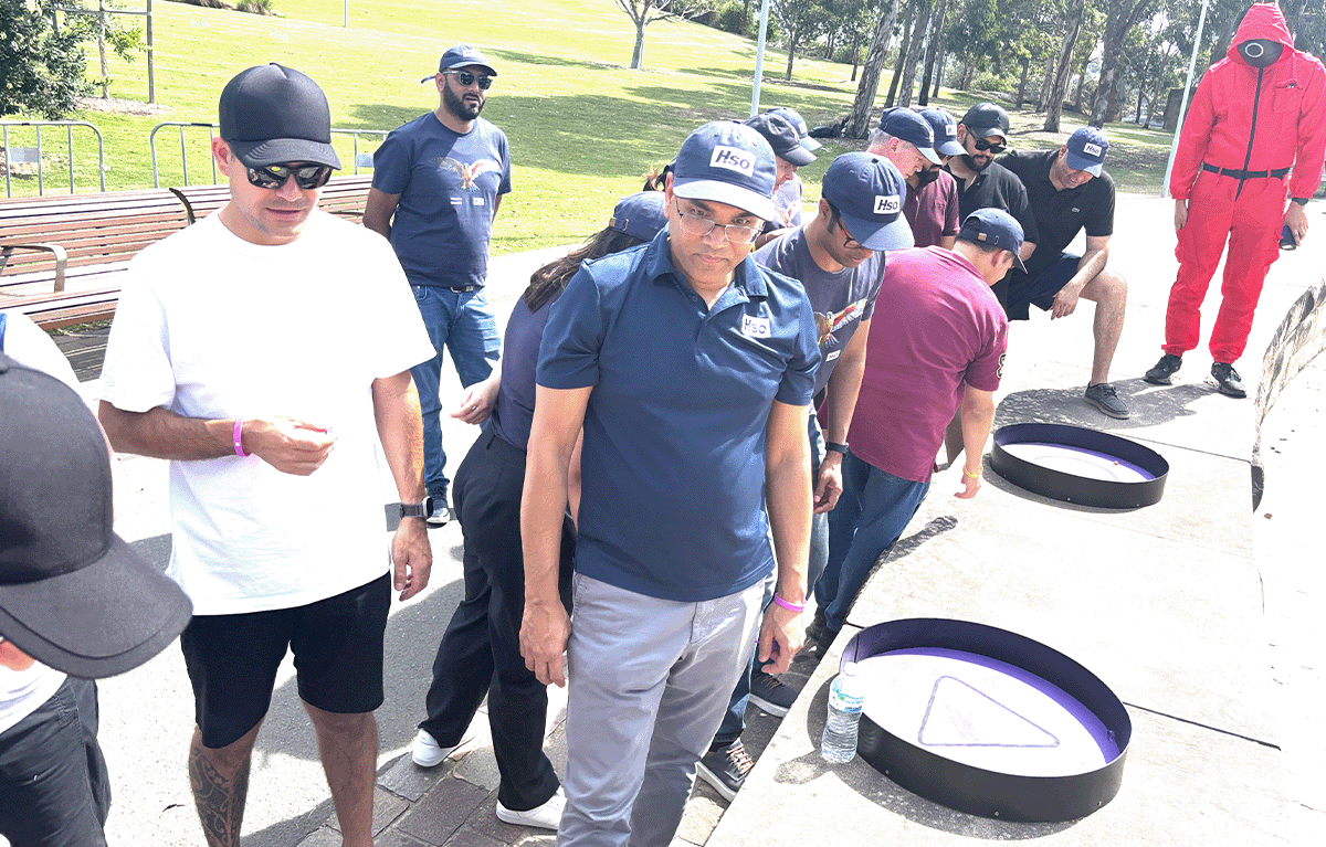 Teams having fun during an outdoor squid games team building activity