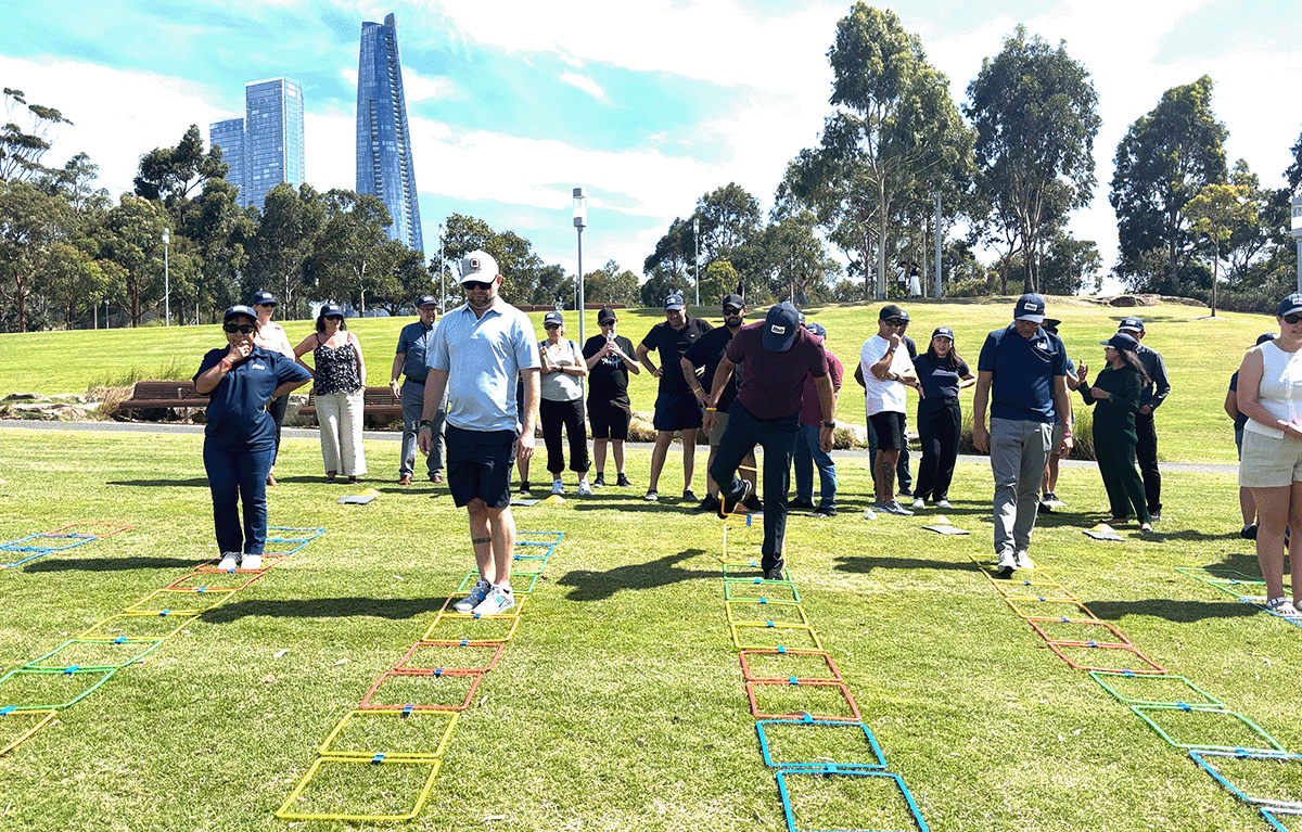 Teams having fun during an outdoor squid games team building activity