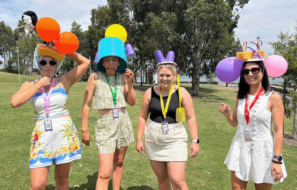 Teams having fun during a Task Master Team building session