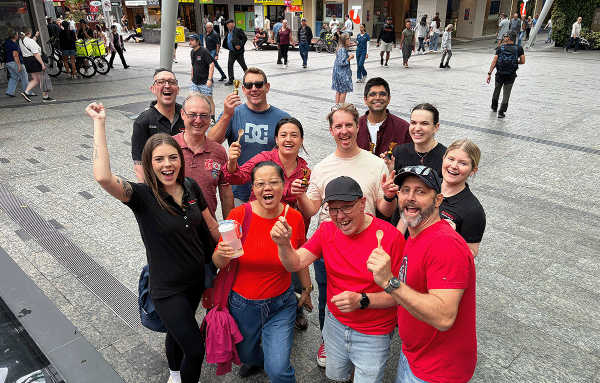 Teams celebrating a win after a Brisbane Amazing Race team building event