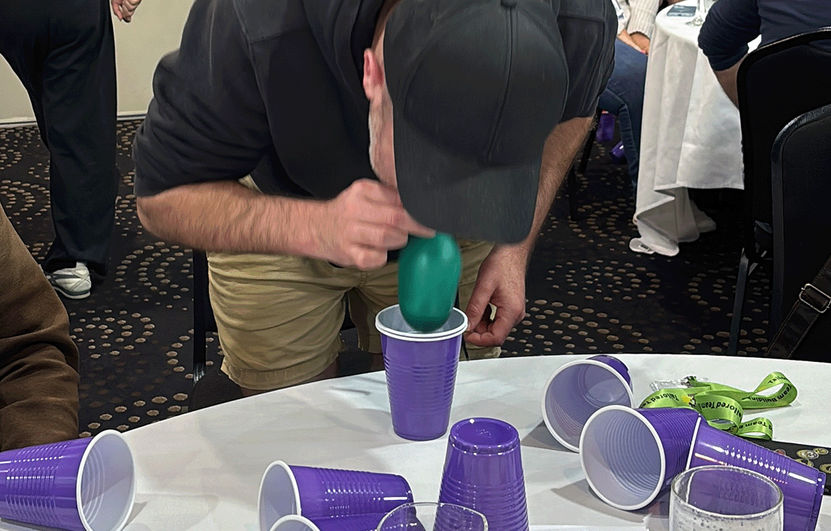 Tailored Team Building hosts leading a fun indoor team building event in Bendigo