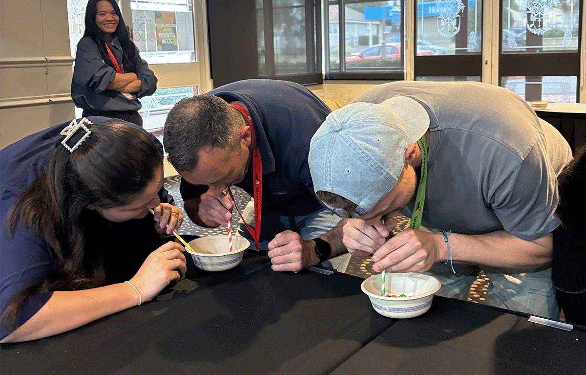 Tailored Team Building hosts leading a fun indoor team building event in Bendigo