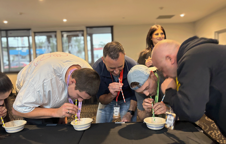 Tailored Team Building hosts leading a fun indoor team building event in Bendigo