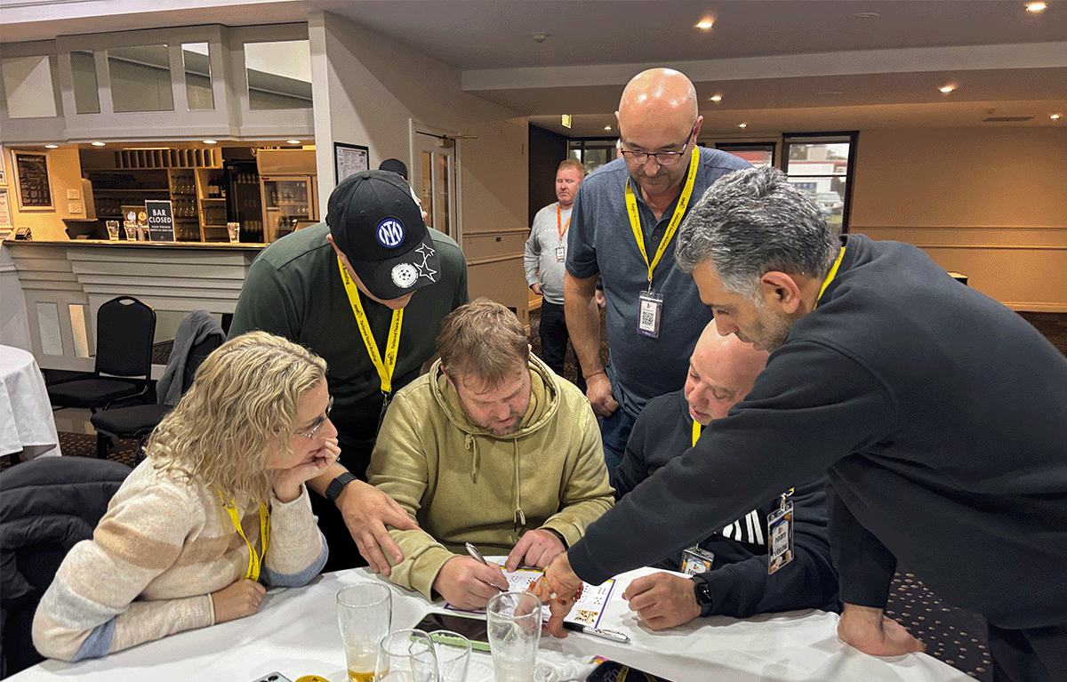 Employees participating in a Tailored Team Building game show event in Bendigo