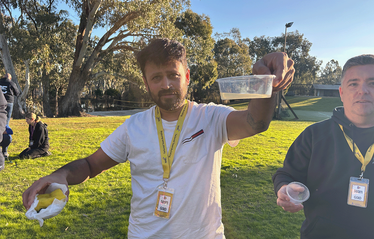 Employees taking part in outdoor Survivor-style team building activities in Nagambie.