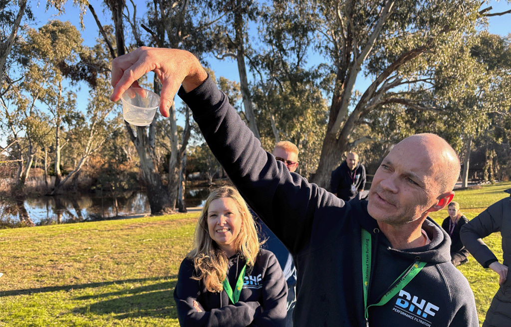 Employees taking part in outdoor Survivor-style team building activities in Nagambie.