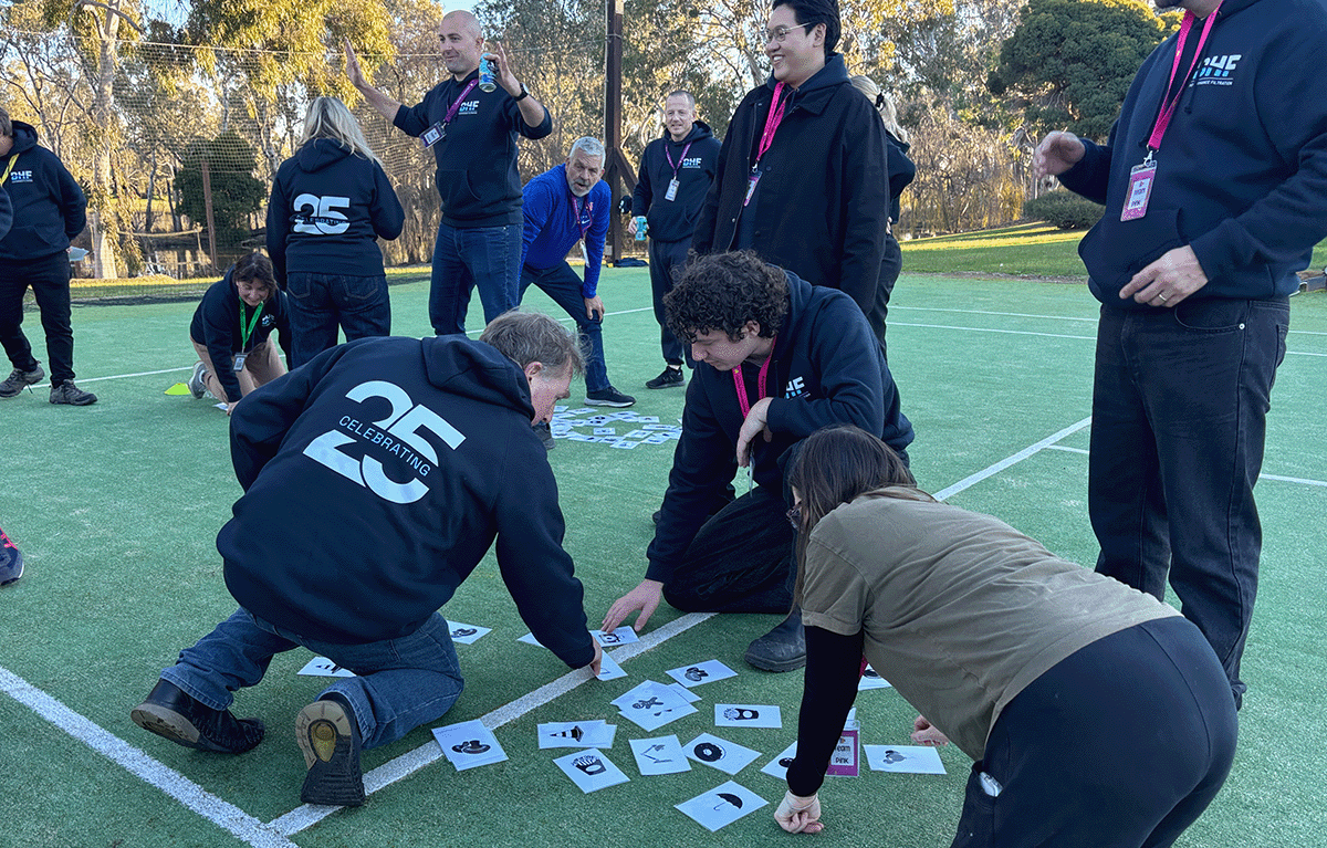 Employees taking part in outdoor Survivor-style team building activities in Nagambie.