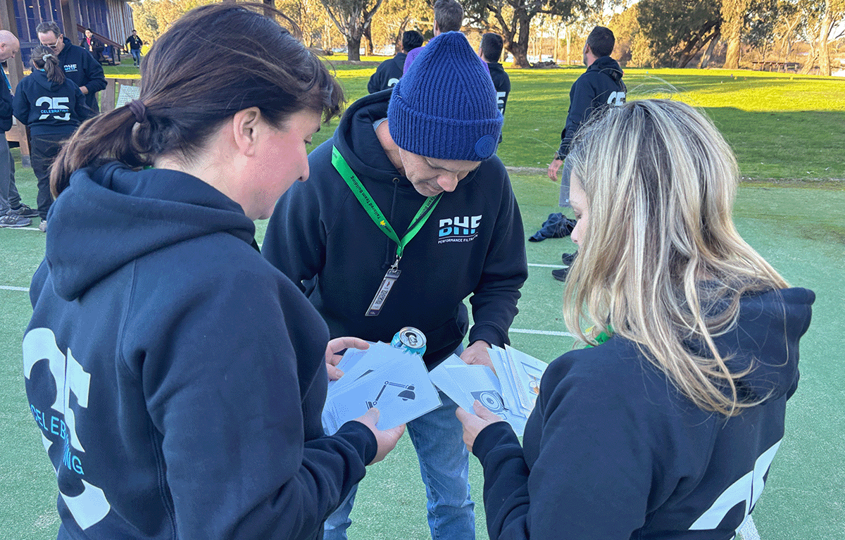 Employees taking part in outdoor Survivor-style team building activities in Nagambie.