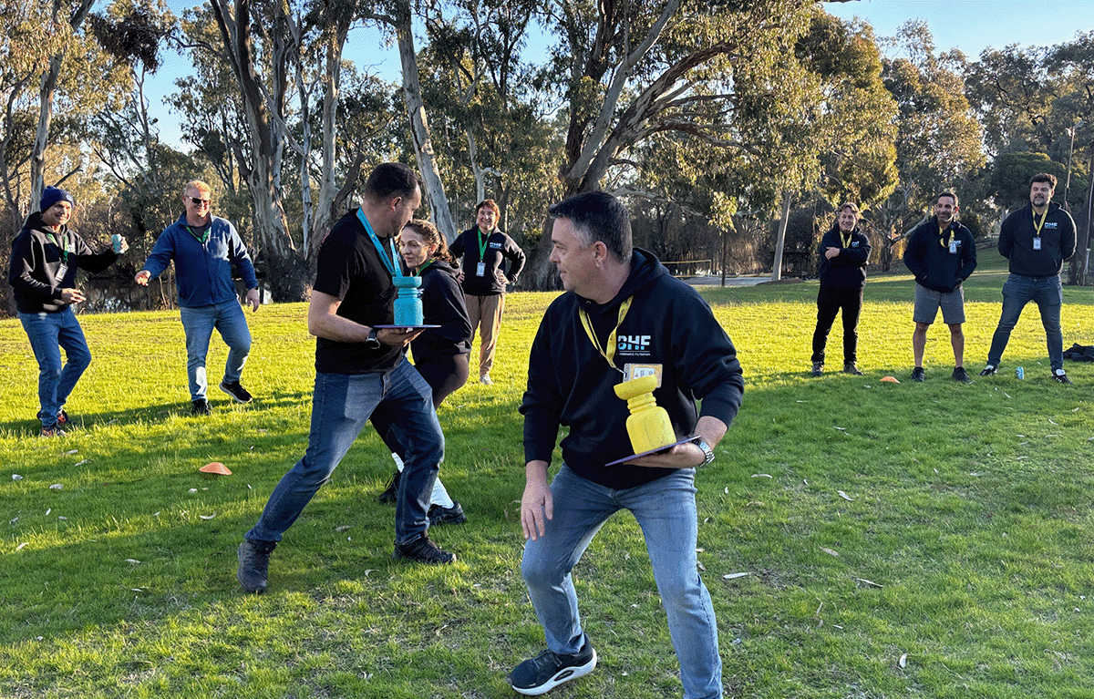 Employees taking part in outdoor Survivor-style team building activities in Nagambie.