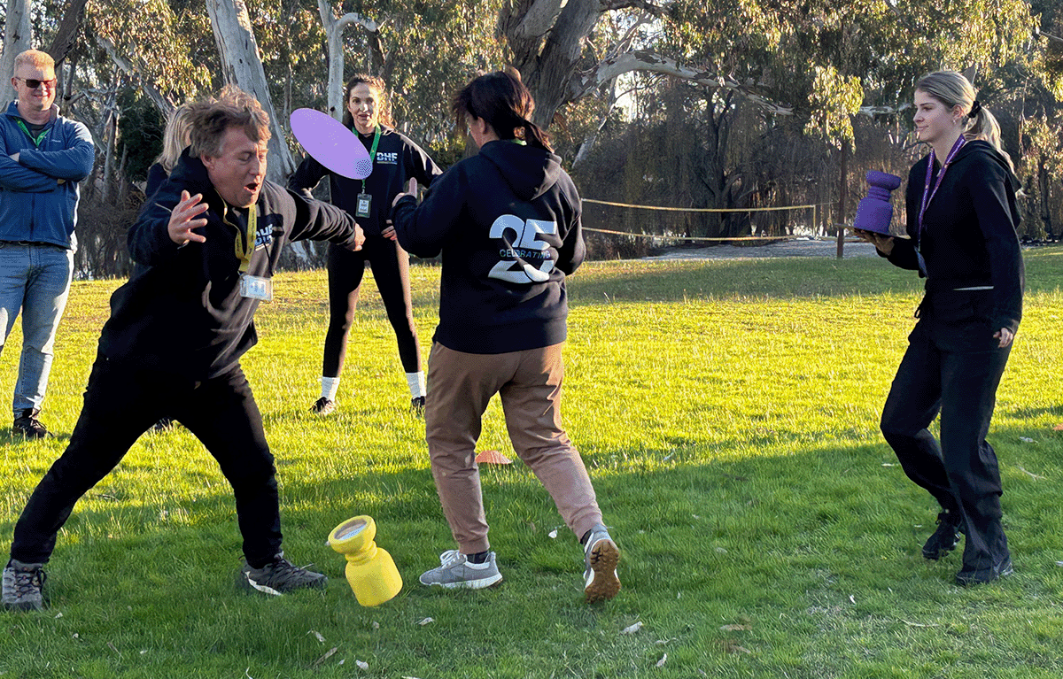 Employees taking part in outdoor Survivor-style team building activities in Nagambie.