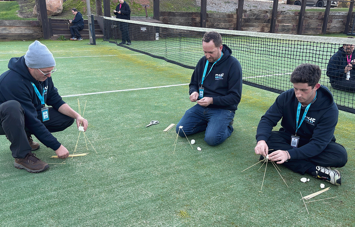 Employees taking part in outdoor Survivor-style team building activities in Nagambie.