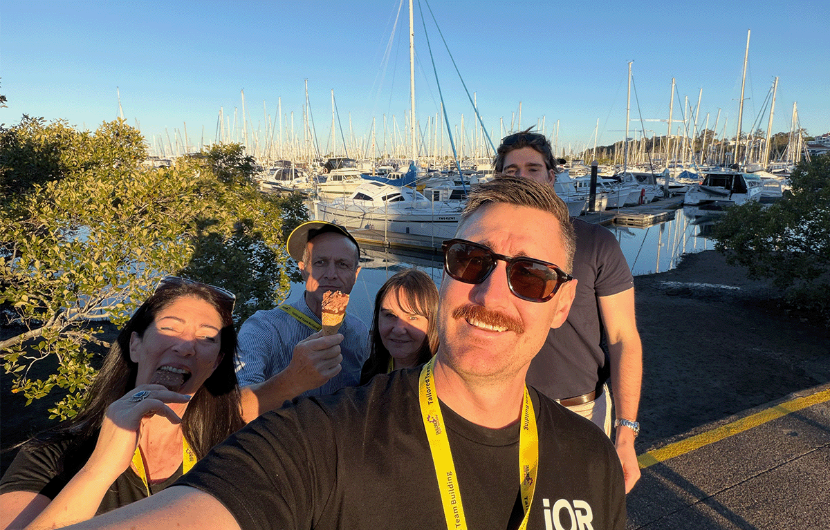 Corporate team completing a Baywatch challenge at Manly Pool.
