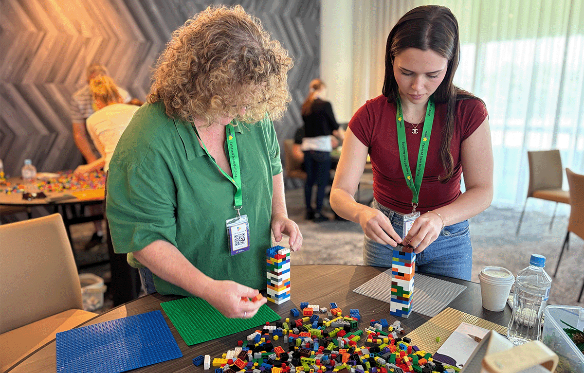 Small corporate team getting competitive during a customised indoor Brick Masters experience.