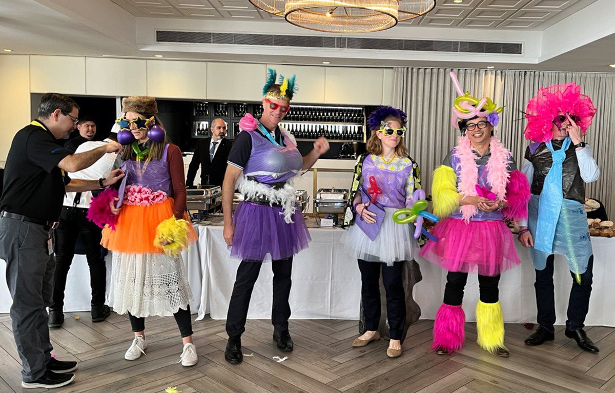 Team members competing in a Game Show style indoor team building event