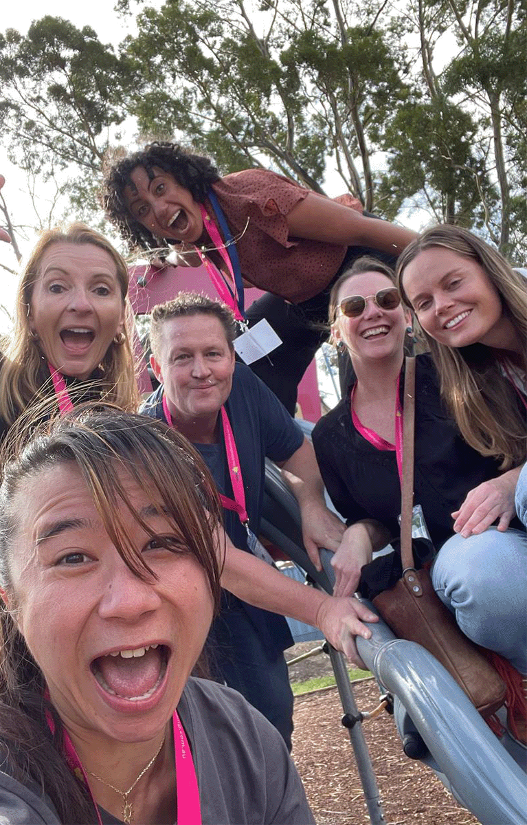 Team enjoying an outdoor team bonding activity hosted by Tailored Team Building