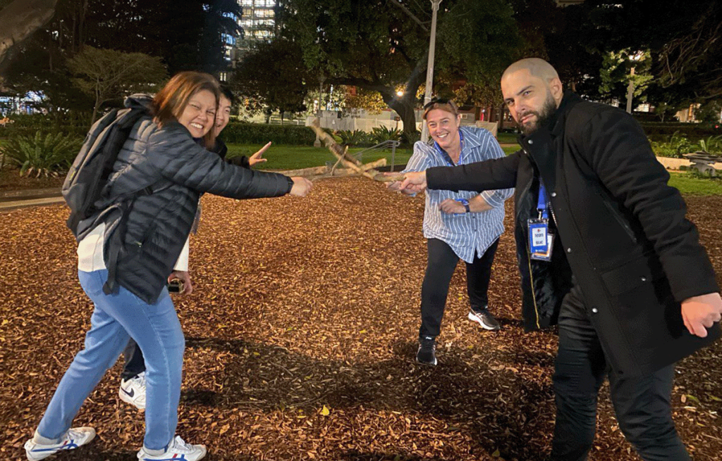 Corporate team building activity with colleagues working together outdoors