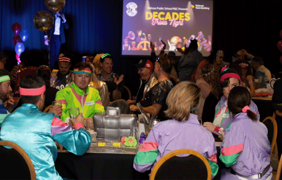 Indoor team bonding game show event with corporate employees