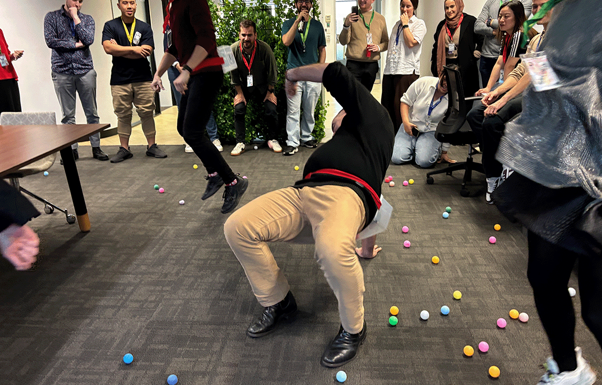 Contestants competing in a fun, high-energy team bonding Game Show activity