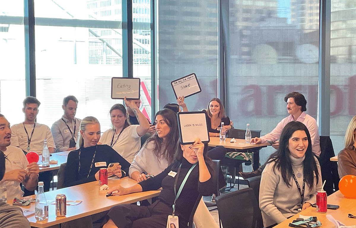 Contestants competing in a fun, high-energy team bonding Game Show activity