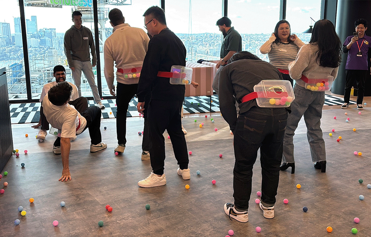 Contestants competing in a fun, high-energy team bonding Game Show activity