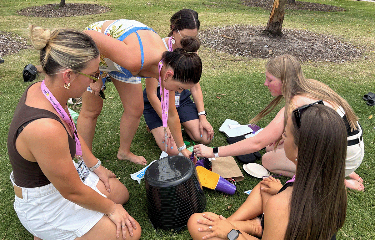 Teams having fun during a Task Master Team building session