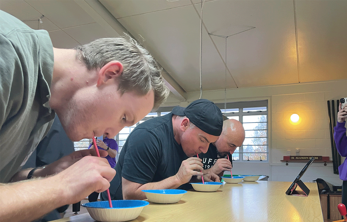 Corporate team building in New Zealand with colleagues competing in Family Feud during a fun indoor Game Show event.
