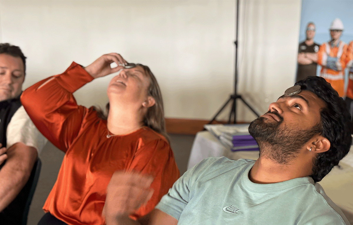 Participants playing Face the Cookie during a corporate Game Show team building event in New Zealand.