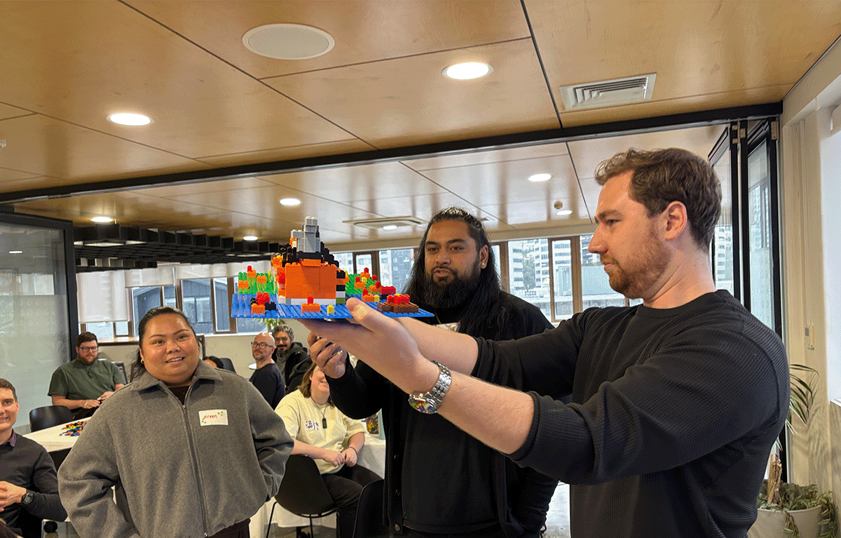 Participants enjoying a fun indoor Brick Masters team building event in Wellington, New Zealand