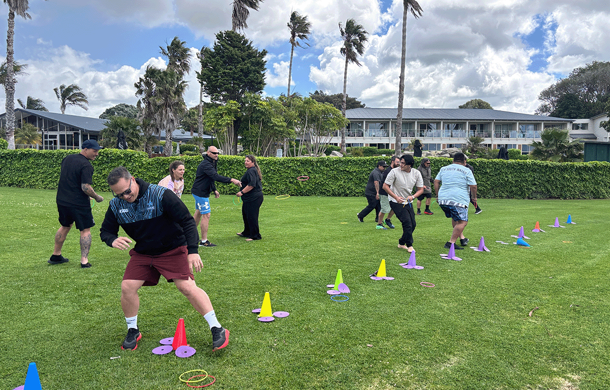 Rosvall Sawmill participants working together during a customised Survivor team building challenge.