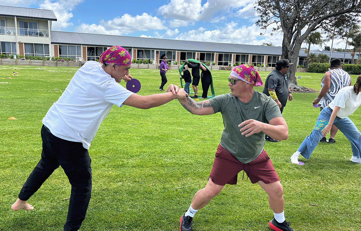 Fun conference breakout session featuring Survivor-style team challenges in the Bay of Islands.