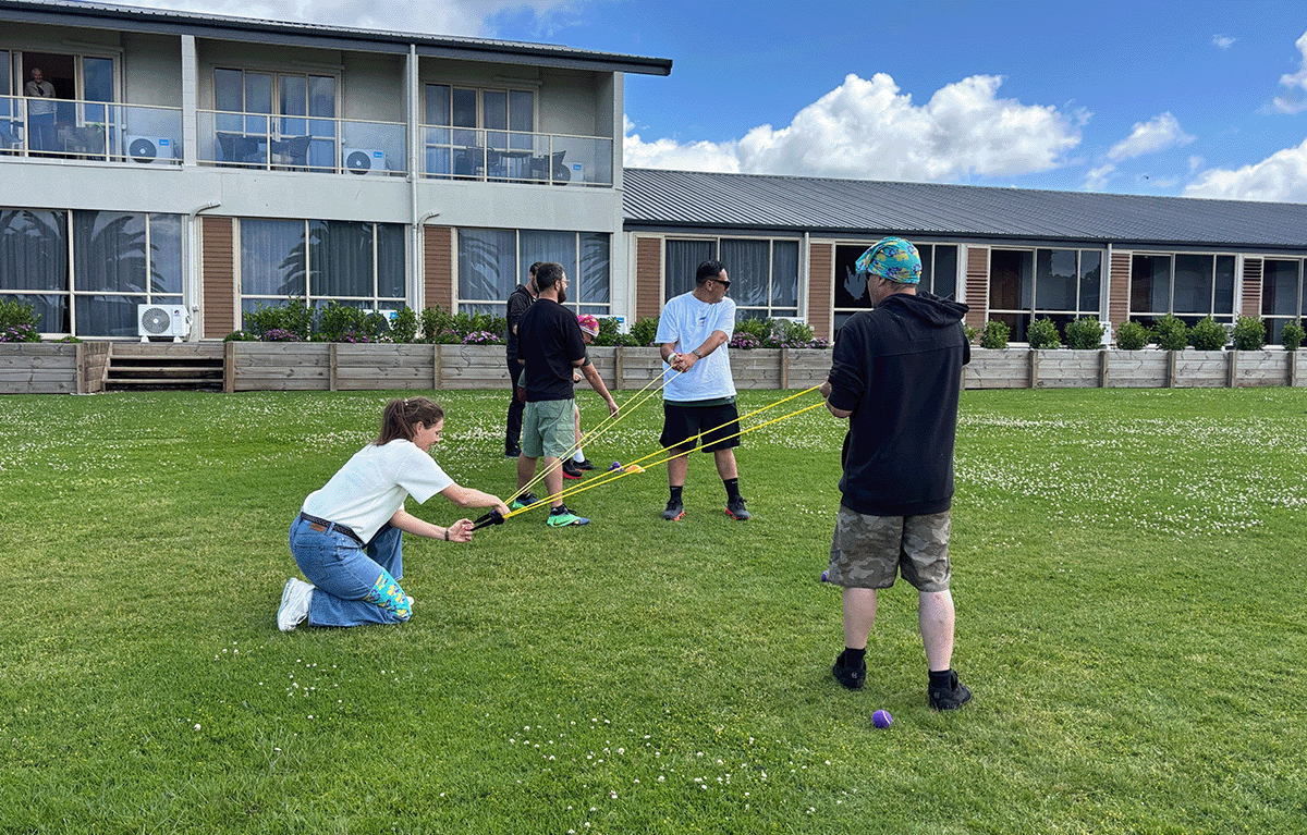 Fun conference breakout session featuring Survivor-style team challenges in the Bay of Islands.