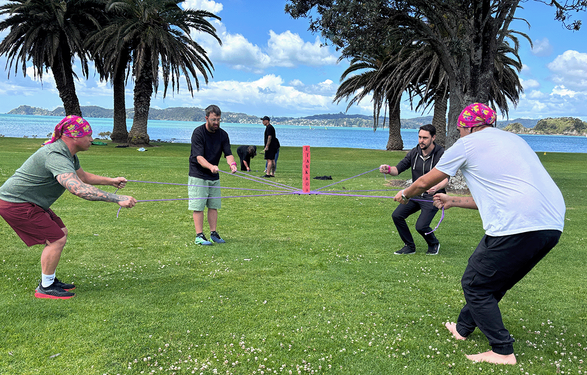Outdoor team building in New Zealand featuring fun and competitive Survivor-inspired activities.